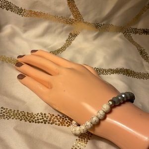 Elastic bracelet w/white crackle beads, shiny gray beads w/silver accent beads.